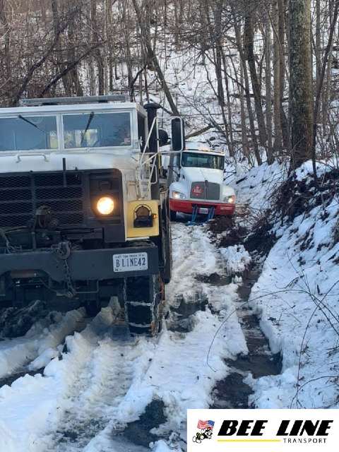 Semi Towing Up An ICY Hill